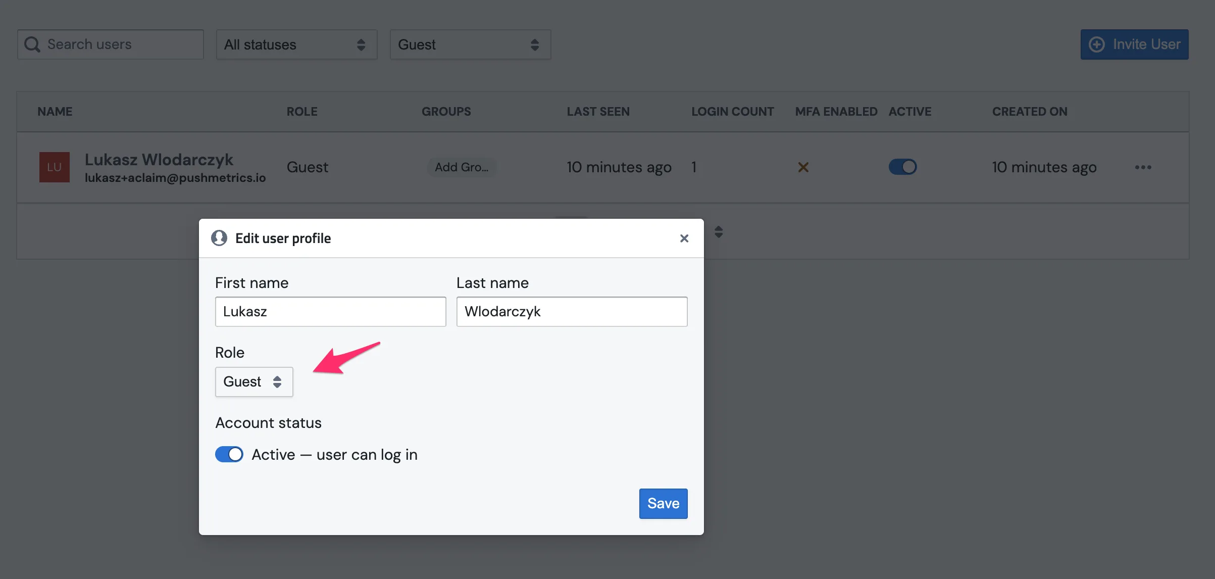 The Users page in Account Settings with a recently auto-joined member's role dropdown open, changing them from Guest to User